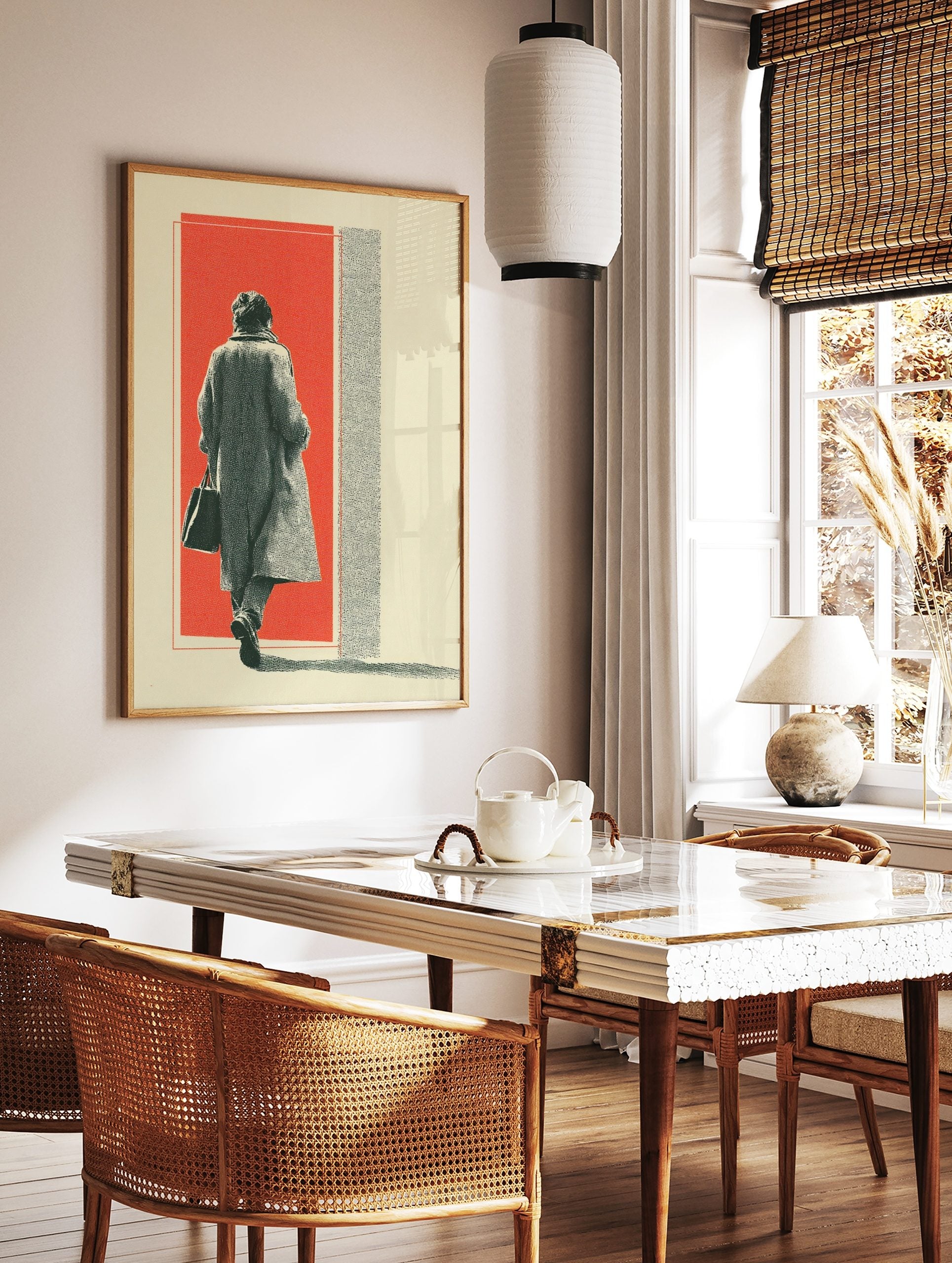 Figure in long coat walking into red background with halftone texture and cream border, in a styled room mockup