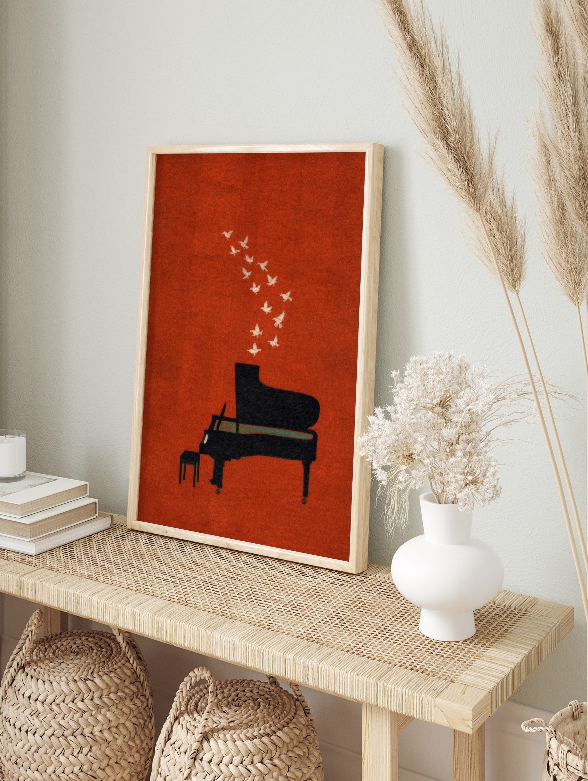 Black grand piano with white doves flying out, against a textured burnt orange background art, in an alternate framed mockup