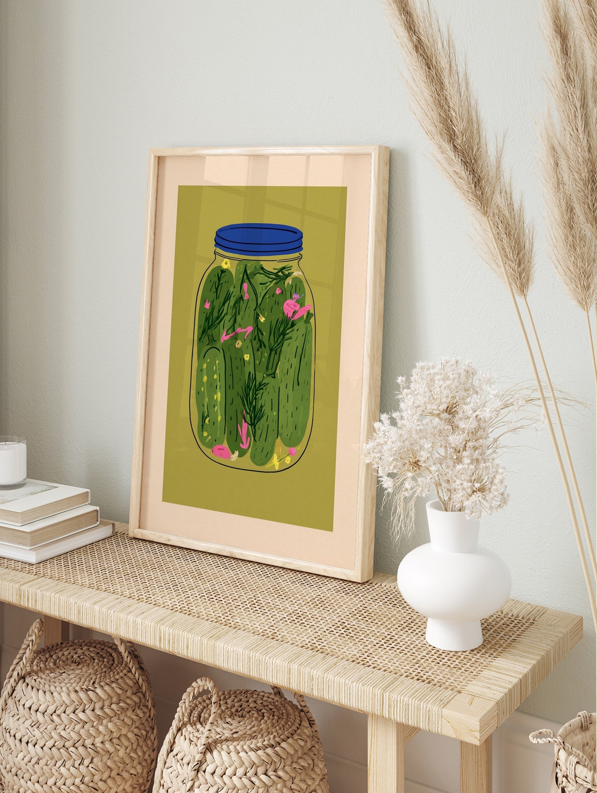 Illustrative jar of pickles with green cucumbers and dill on olive green background, in an alternate framed mockup