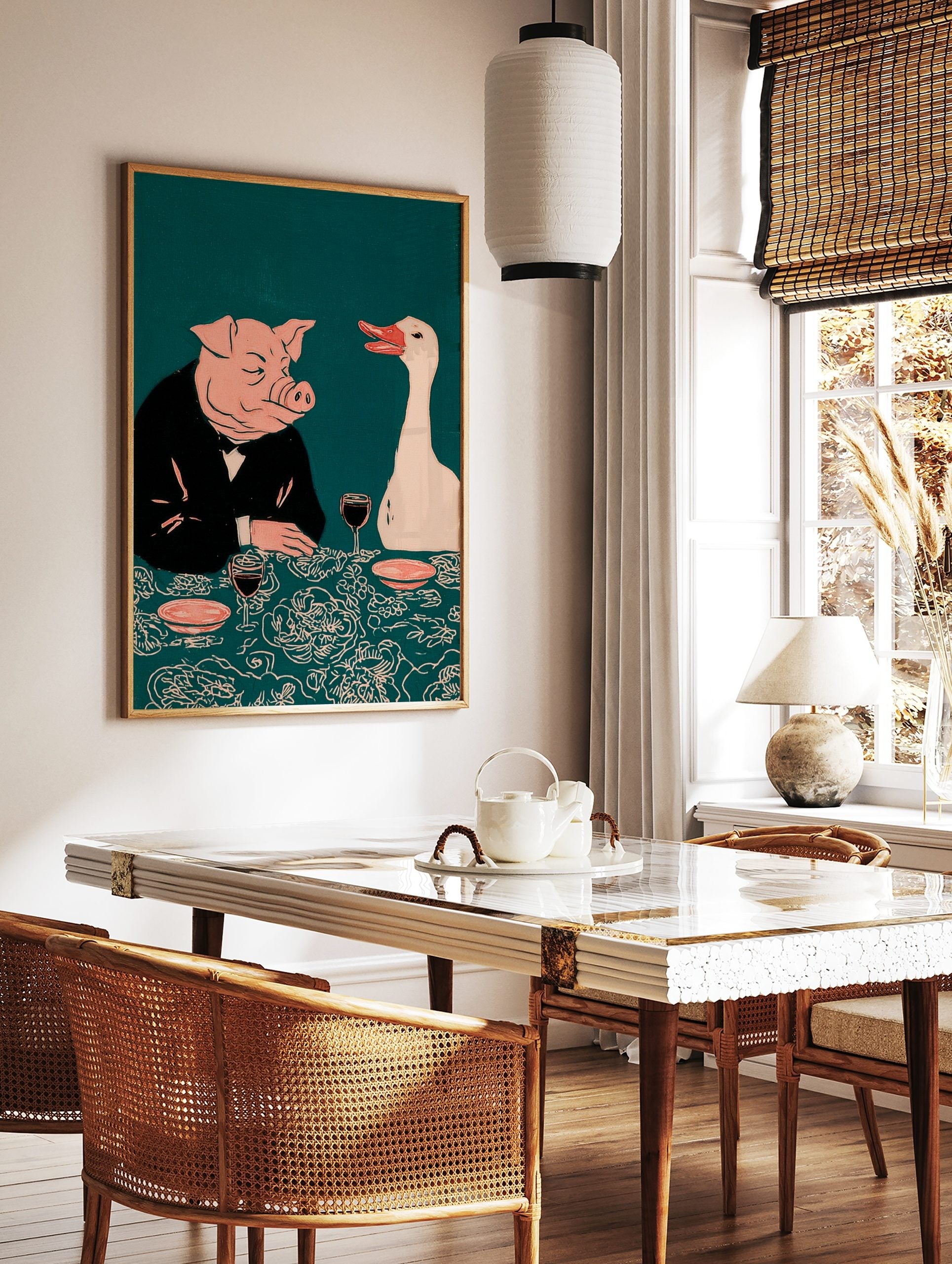 Illustrative print of a pig in a suit and a white goose at a dinner table with wine, on a teal, in a styled room mockup