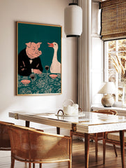 Illustrative print of a pig in a suit and a white goose at a dinner table with wine, on a teal, in a styled room mockup