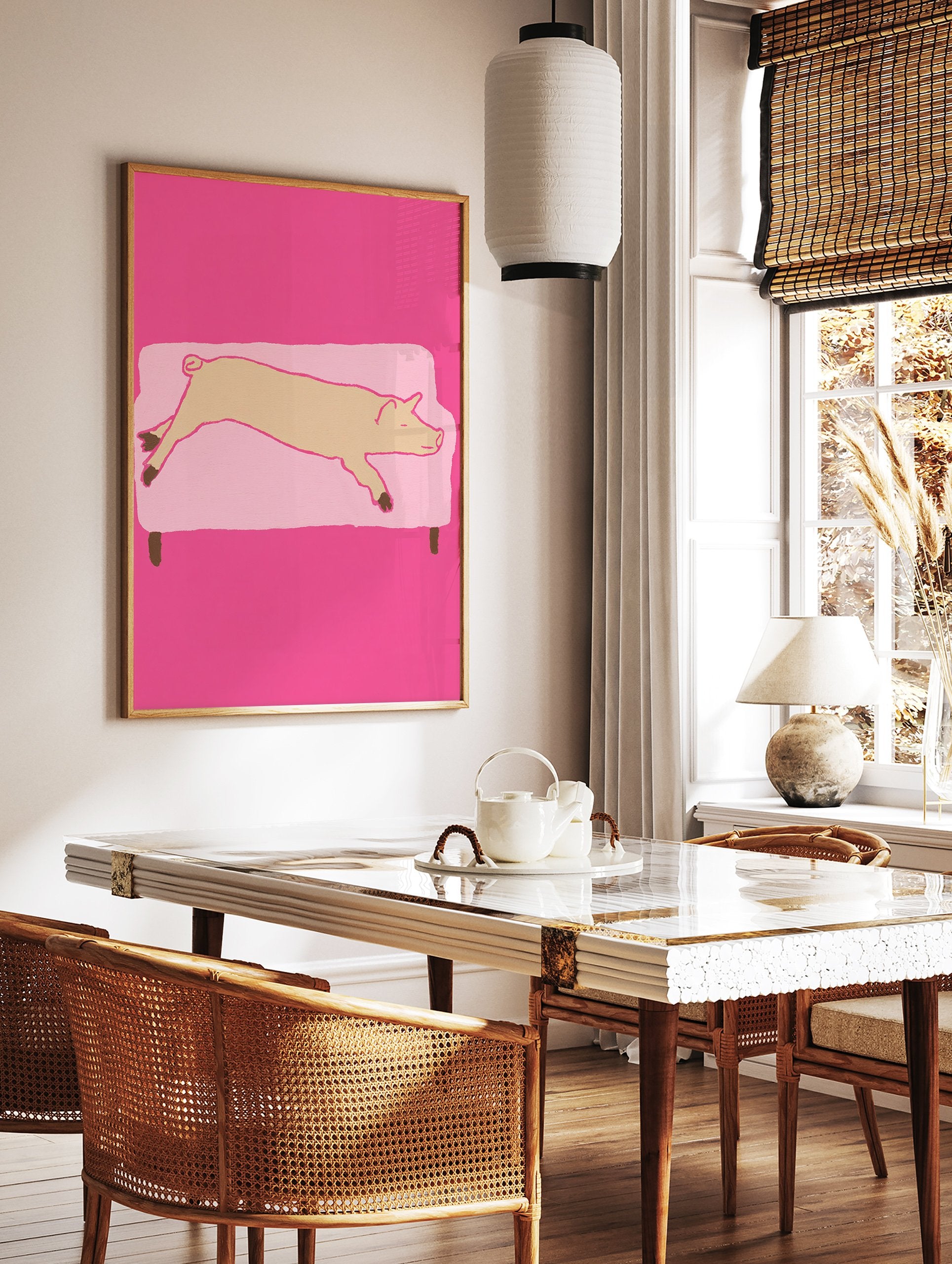 Whimsical pig wall art illustration showing a light brown pig sleeping on a light pink couch against a vibrant pink background. - Image 2