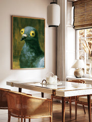 Close-up illustrative painting of a pigeon with large yellow eyes against a dark, textured, in a styled room mockup
