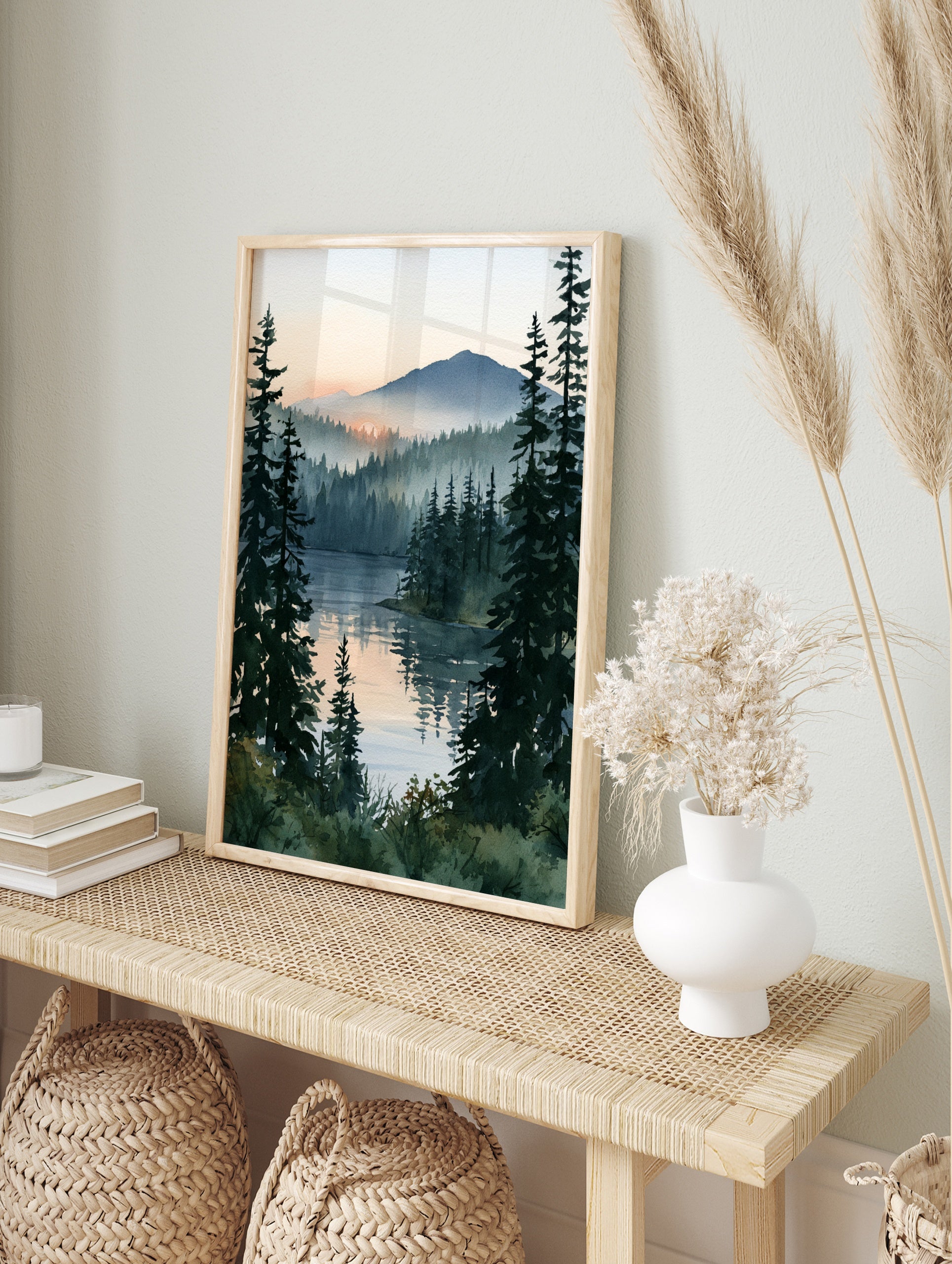 Watercolor-style misty pine forest landscape with sunrise reflecting on a calm lake, vertical, in an alternate framed mockup