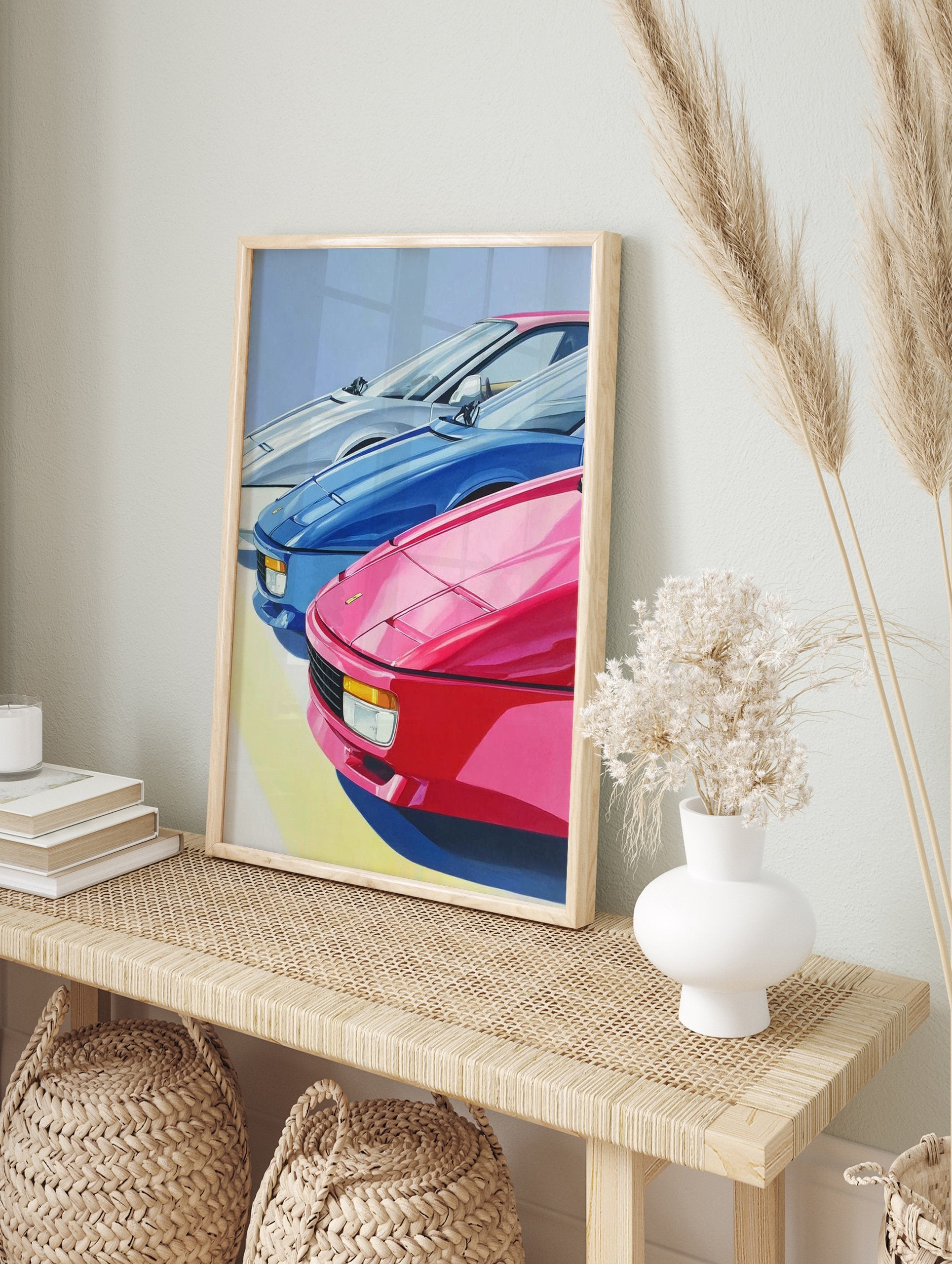 Vibrant sports car poster featuring three classic cars in pink, blue, and white, with a light blue sky background. - Image 4