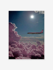 Pink airplane flying above fluffy magenta clouds under a bright blue sky with the sun shining, surreal wall art.