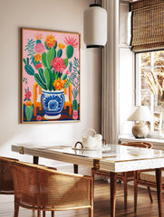Vibrant pink cactus poster with green cacti and colorful red, orange, and yellow flowers in a blue and white decorative pot on a pink background. - Image 2