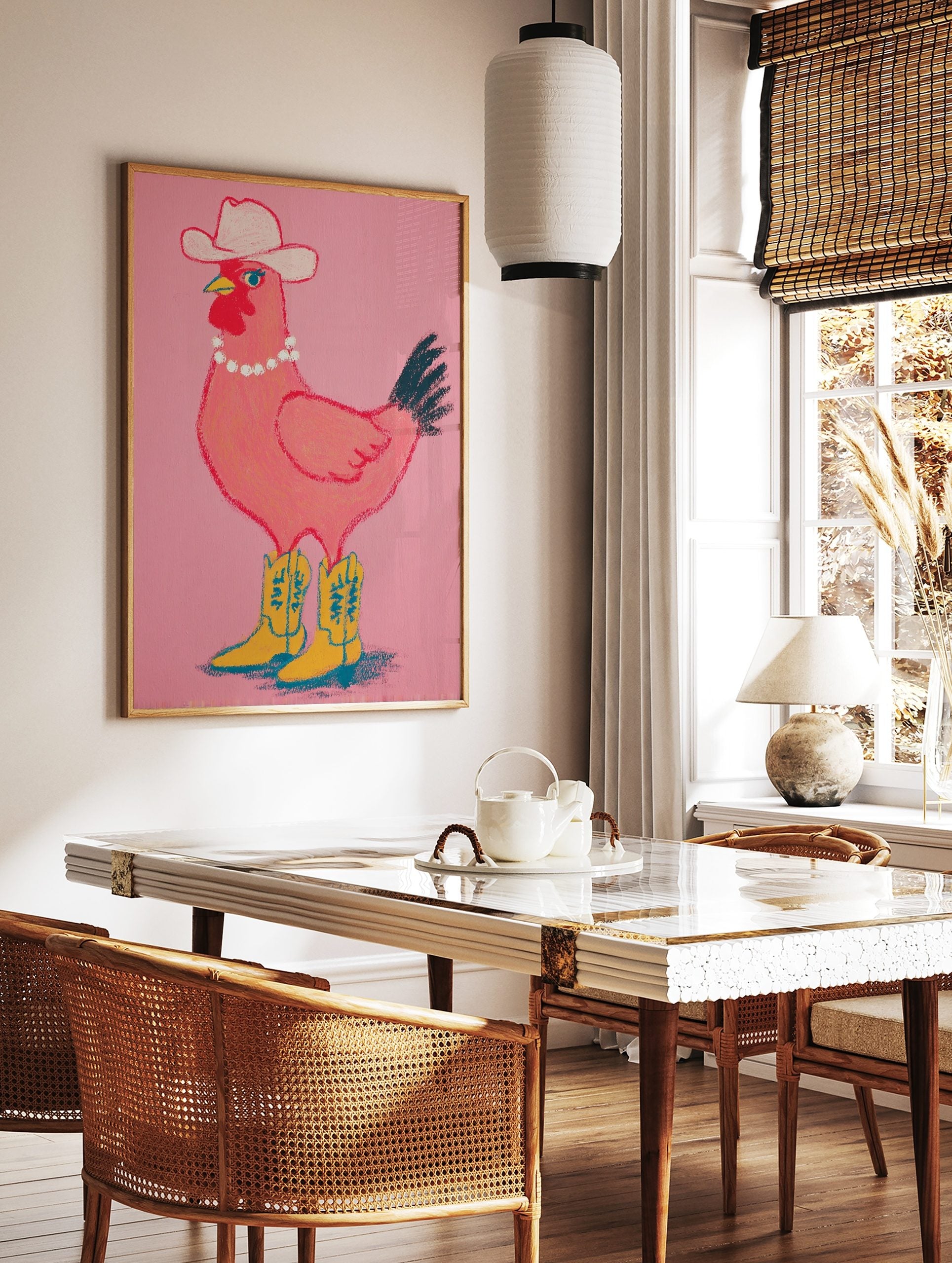 Pink chicken wearing a white cowboy hat, pearl necklace, and yellow cowboy boots on a pink, in a styled room mockup