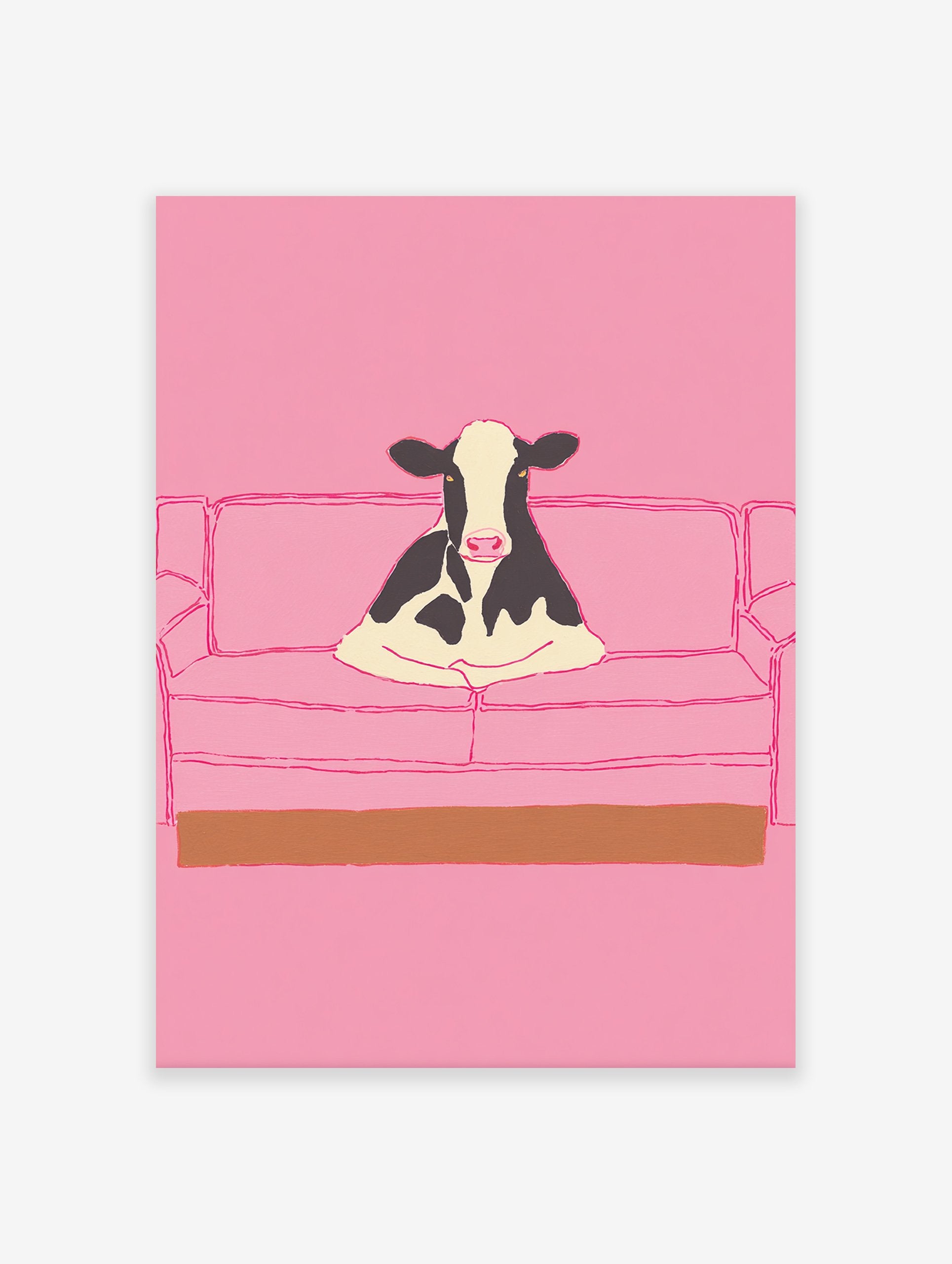 Illustrative art print of a black and white cow sitting on a pink couch, set against a solid pink background.