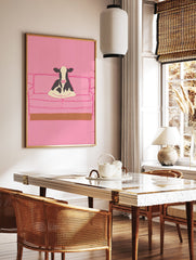 Illustrative art print of a black and white cow sitting on a pink couch, set against a solid pink background. - Image 2