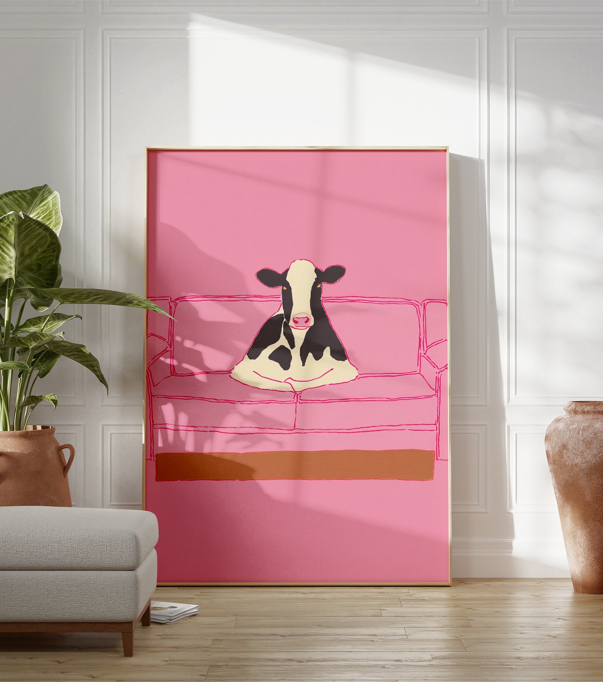 Illustrative art print of a black and white cow sitting on a pink couch, set against a solid pink background. - Image 3