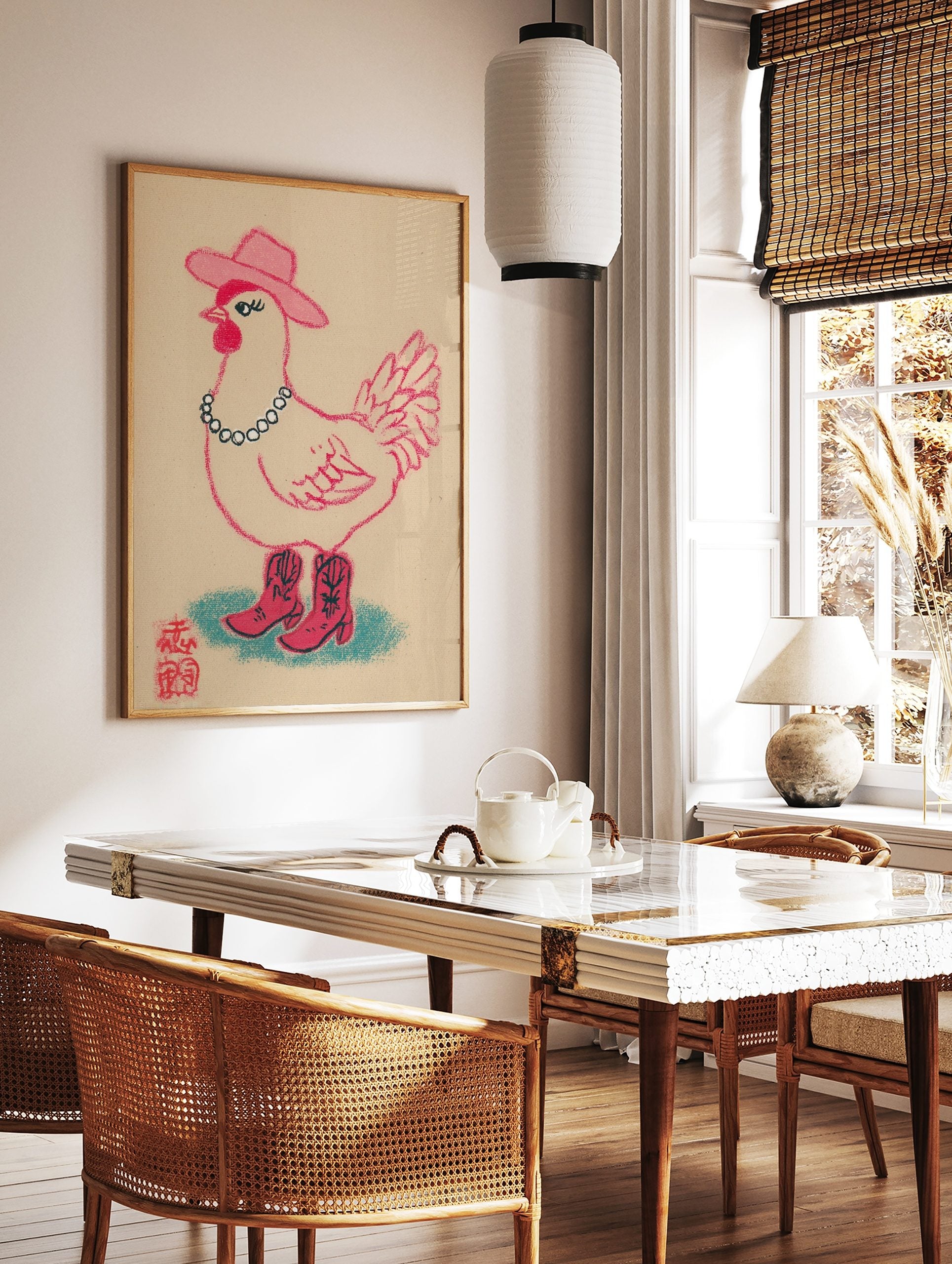 Illustrative print of a pink cowgirl chicken wearing a cowboy hat, beaded necklace, and boots on a, in a styled room mockup