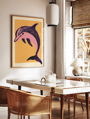 Stylized pink dolphin illustration on a textured orange background, illustrative sea animal wall, in a styled room mockup