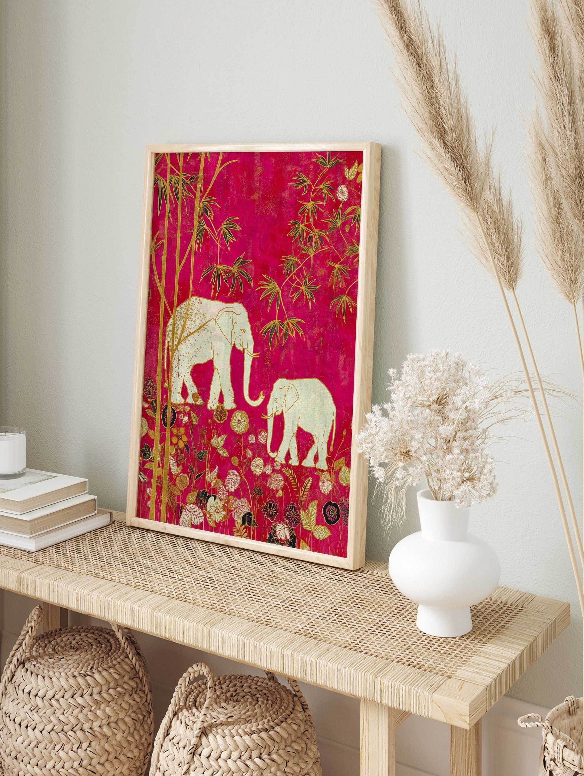 Illustrative wall art with two white elephants, golden bamboo, and ornate flowers on a, in an alternate framed mockup
