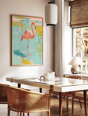 Pink flamingo bird standing in shallow blue and yellow water, painted with abstract brushstrokes, in a styled room mockup