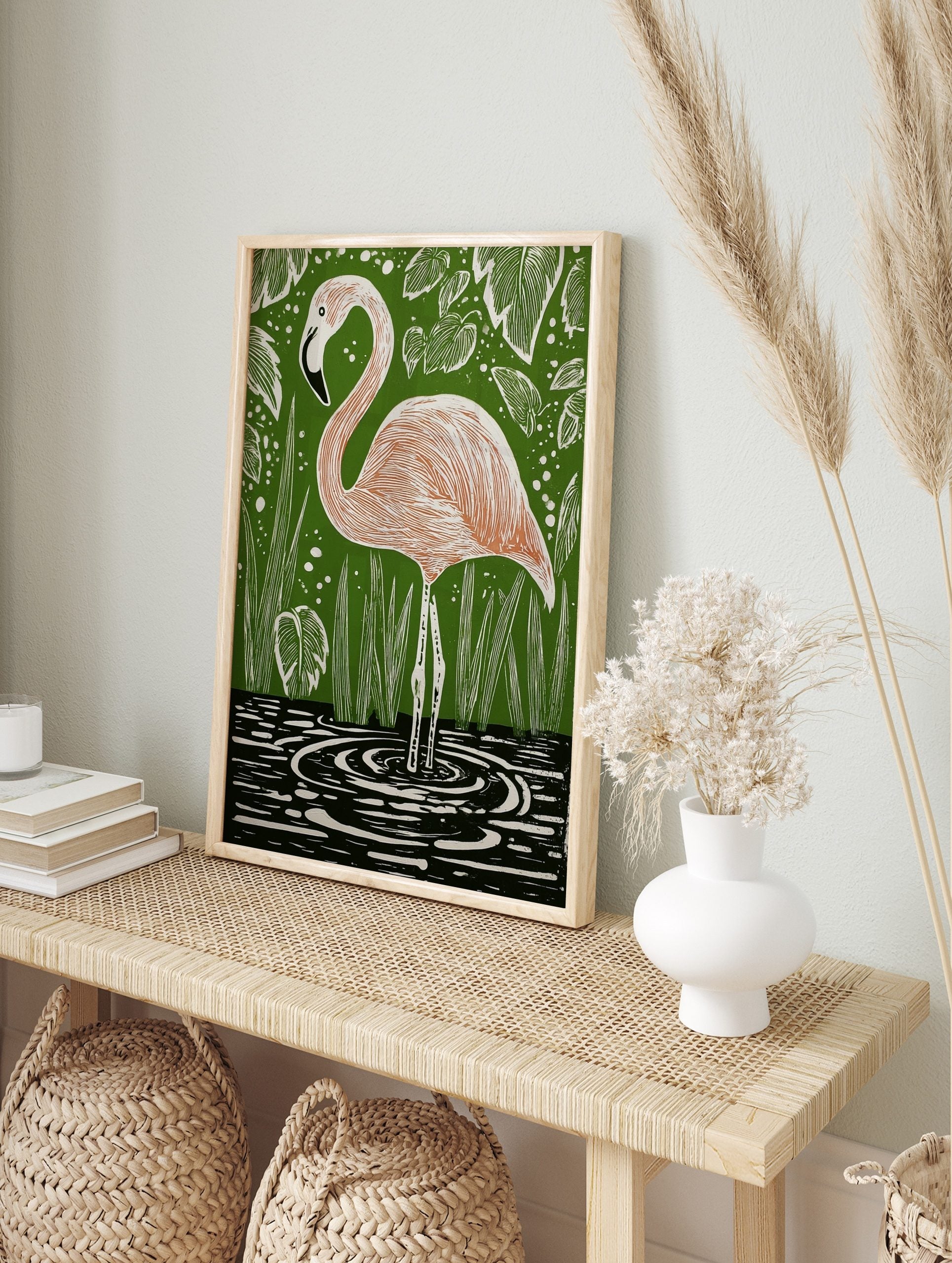 Illustrative pink flamingo standing in water with green foliage background art print, in an alternate framed mockup
