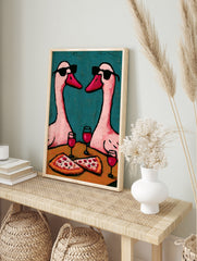 Illustration of two pink geese wearing sunglasses sharing pizza and red wine against a, in an alternate framed mockup