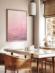 Pink Ocean Surfer Poster featuring multiple surfers waiting in calm, pink-hued water with sun reflections. - Image 2