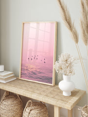 Pink Ocean Surfer Poster featuring multiple surfers waiting in calm, pink-hued water with sun reflections. - Image 4