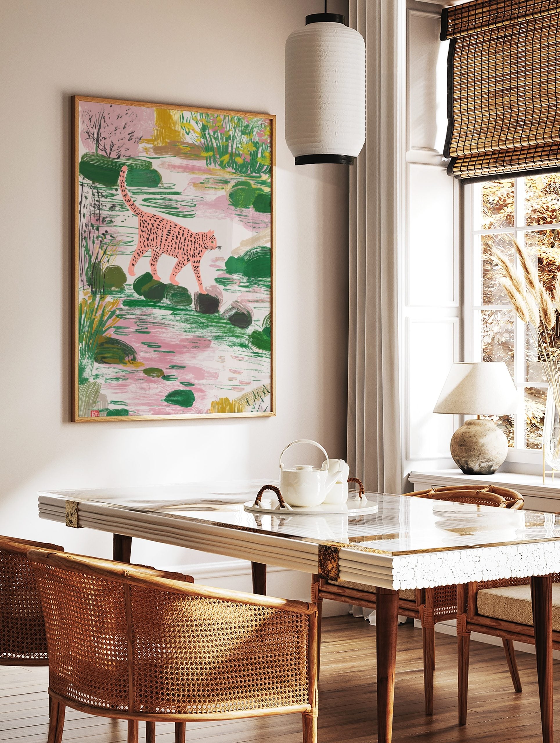 Pink spotted leopard walking on stepping stones in a lush green and pink pond scene, illustrative, in a styled room mockup