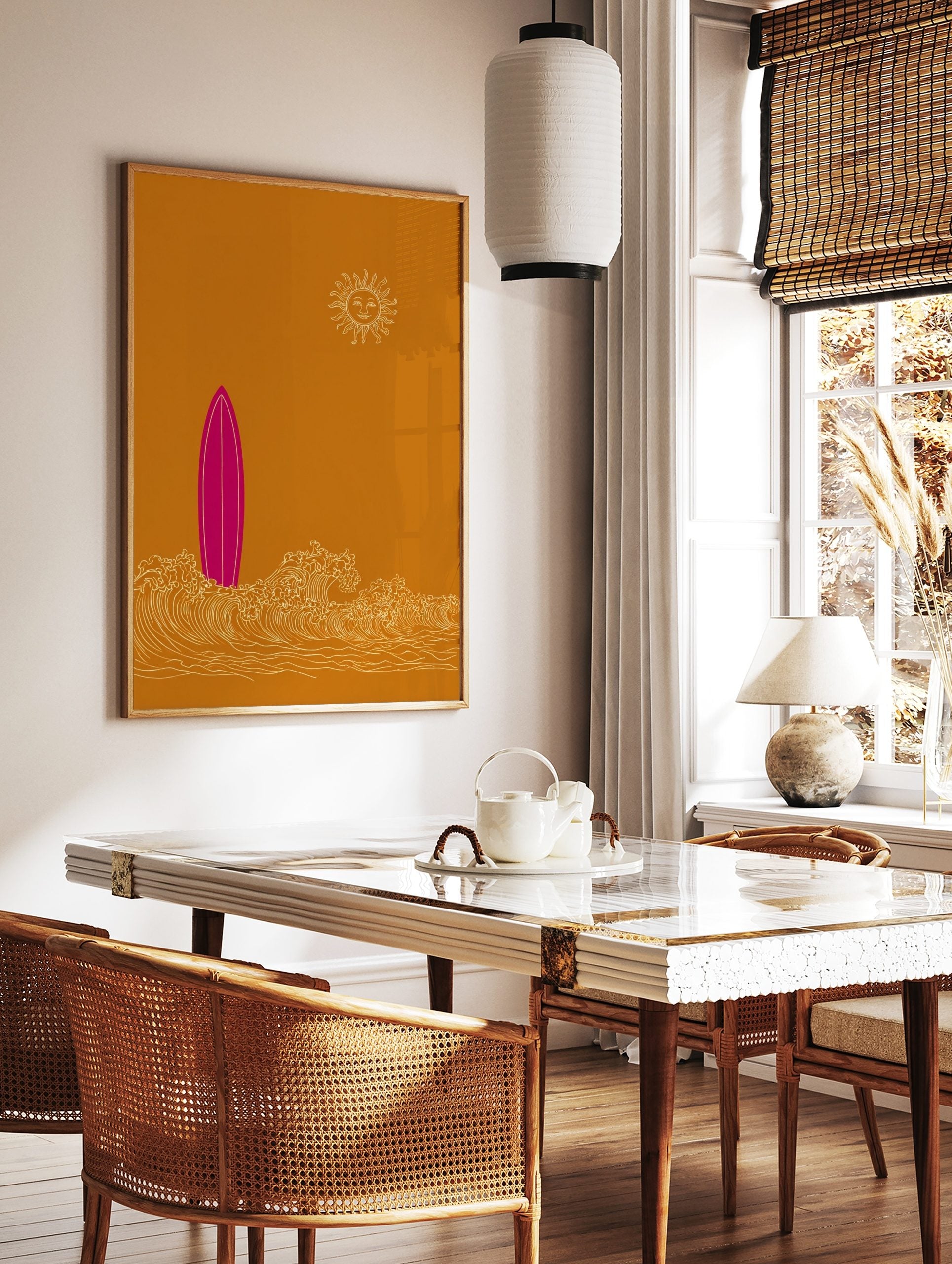 Pink surfboard standing in white ocean waves with a smiling sun on an ochre background in an, in a styled room mockup