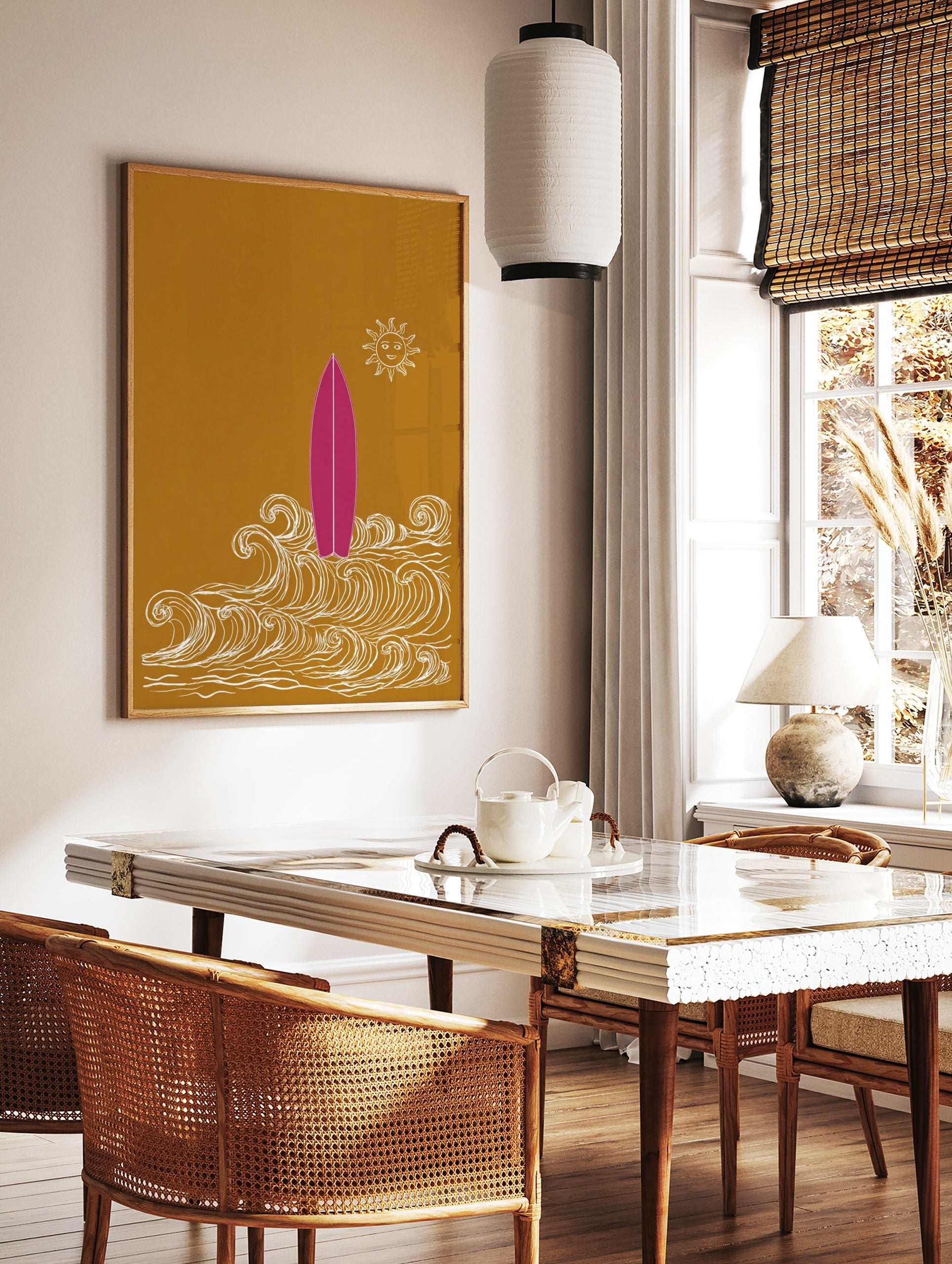 Pink surfboard standing in white illustrative waves with a smiling sun on a golden-yellow background, in a styled room mockup