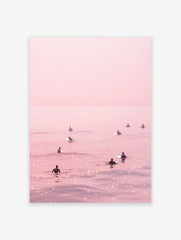 Pink surfer poster showing multiple surfers on a calm, shimmering pink ocean under a pastel sky.