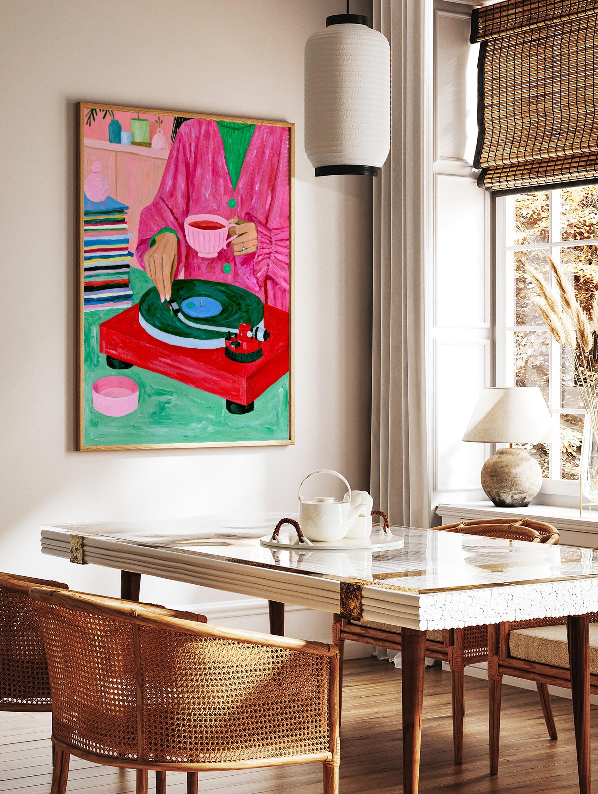 Illustration of a person in a pink coat with tea and a red record player on a green surface, in a styled room mockup