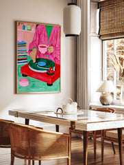 Illustration of a person in a pink coat with tea and a red record player on a green surface, in a styled room mockup