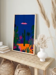 Pink UFO flying over a vibrant desert landscape with various green cacti and plants under a deep blue night sky poster. - Image 4