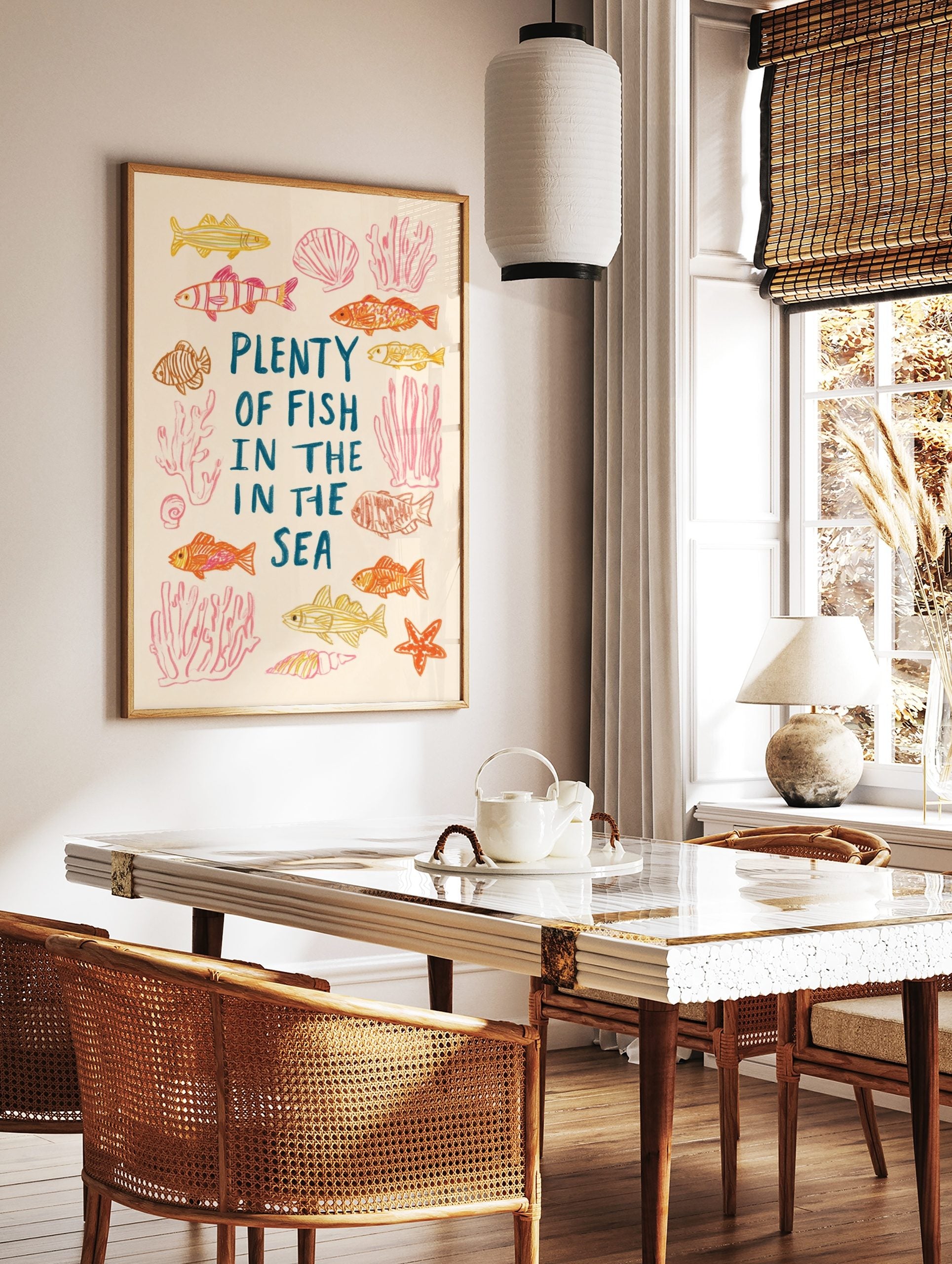 Illustrative Plenty of Fish in the Sea print with hand-drawn fish, coral, seashells, and starfish, in a styled room mockup