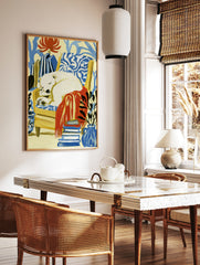 Sleeping polar bear in a yellow armchair with a red blanket, plants, and books, illustrative art, in a styled room mockup
