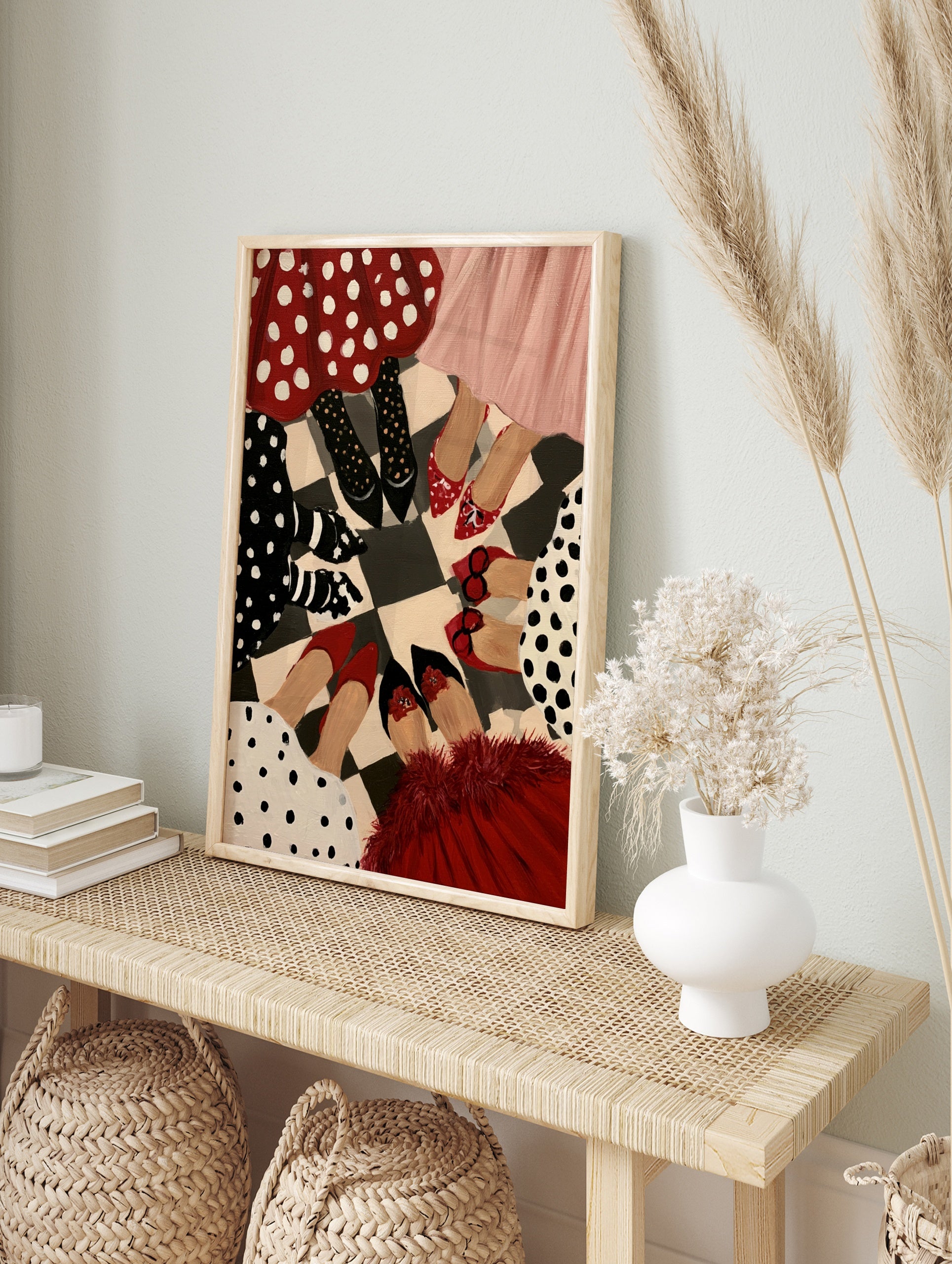 Illustrative fashion print of women in polka dot skirts and heels standing in a circle on a, in an alternate framed mockup