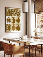 Nine-panel grid illustration of pomegranates and leaves in brown and beige on a paper print, in a styled room mockup