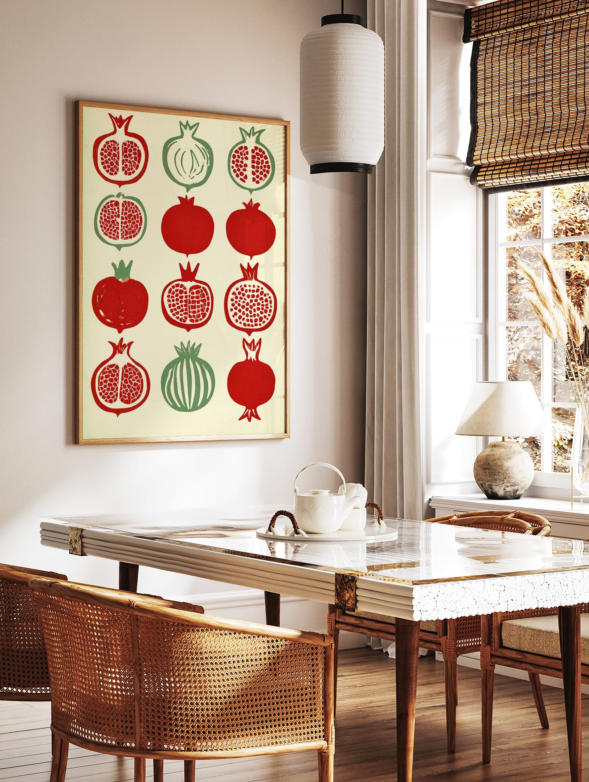 Illustrative pomegranate botanical grid print with red and green fruit on cream background, in a styled room mockup
