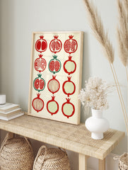 Grid of twelve stylized pomegranate fruit illustrations in red and green on a cream background, in an alternate framed mockup