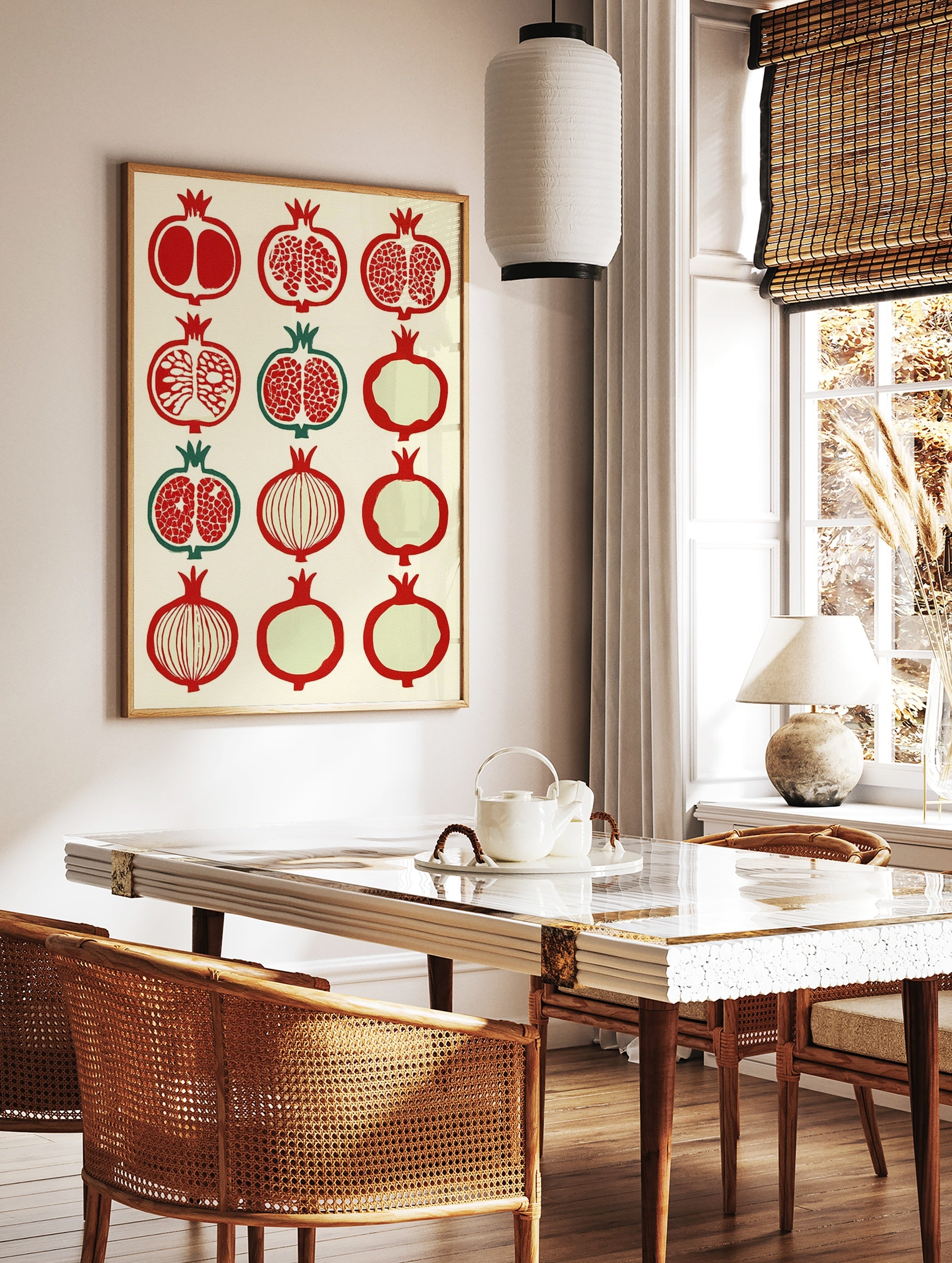 Grid of twelve stylized pomegranate fruit illustrations in red and green on a cream background, in a styled room mockup