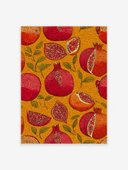 Illustrative Pomegranate wall art print with whole and sliced red and orange pomegranates and green leaves on a textured yellow background.