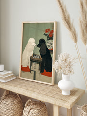White and black poodles playing chess at a small table, with red spider lilies in a vase, in, in an alternate framed mockup