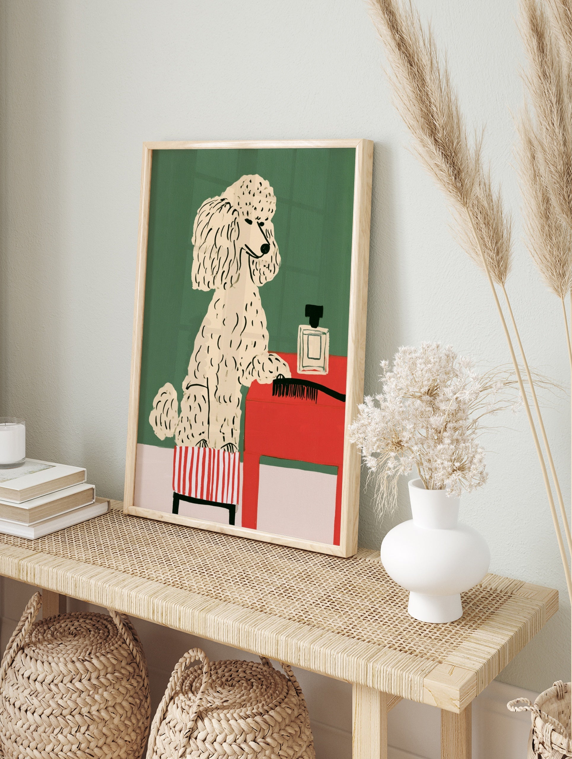 Illustrative poodle on a striped stool next to a red table with a perfume bottle and, in an alternate framed mockup