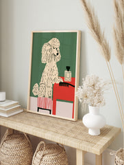 Illustrative poodle on a striped stool next to a red table with a perfume bottle and, in an alternate framed mockup