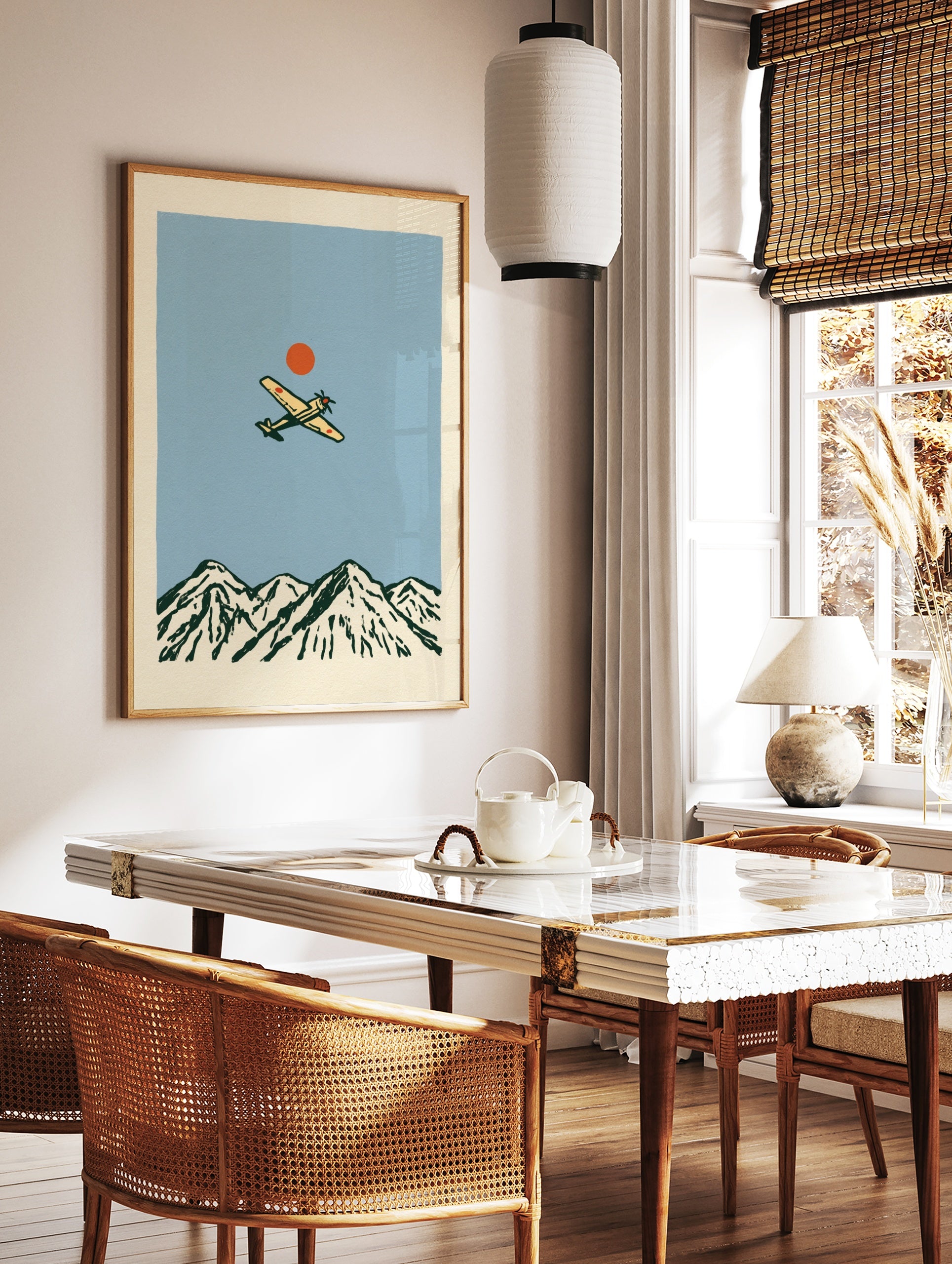 Vintage style illustration of a propeller aircraft flying over a mountain range with a red sun, in a styled room mockup