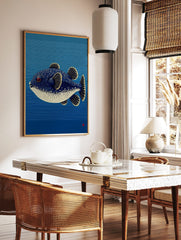 Illustrative puffer fish with blue, white spots, red eye, yellow fins against blue striped, in a styled room mockup