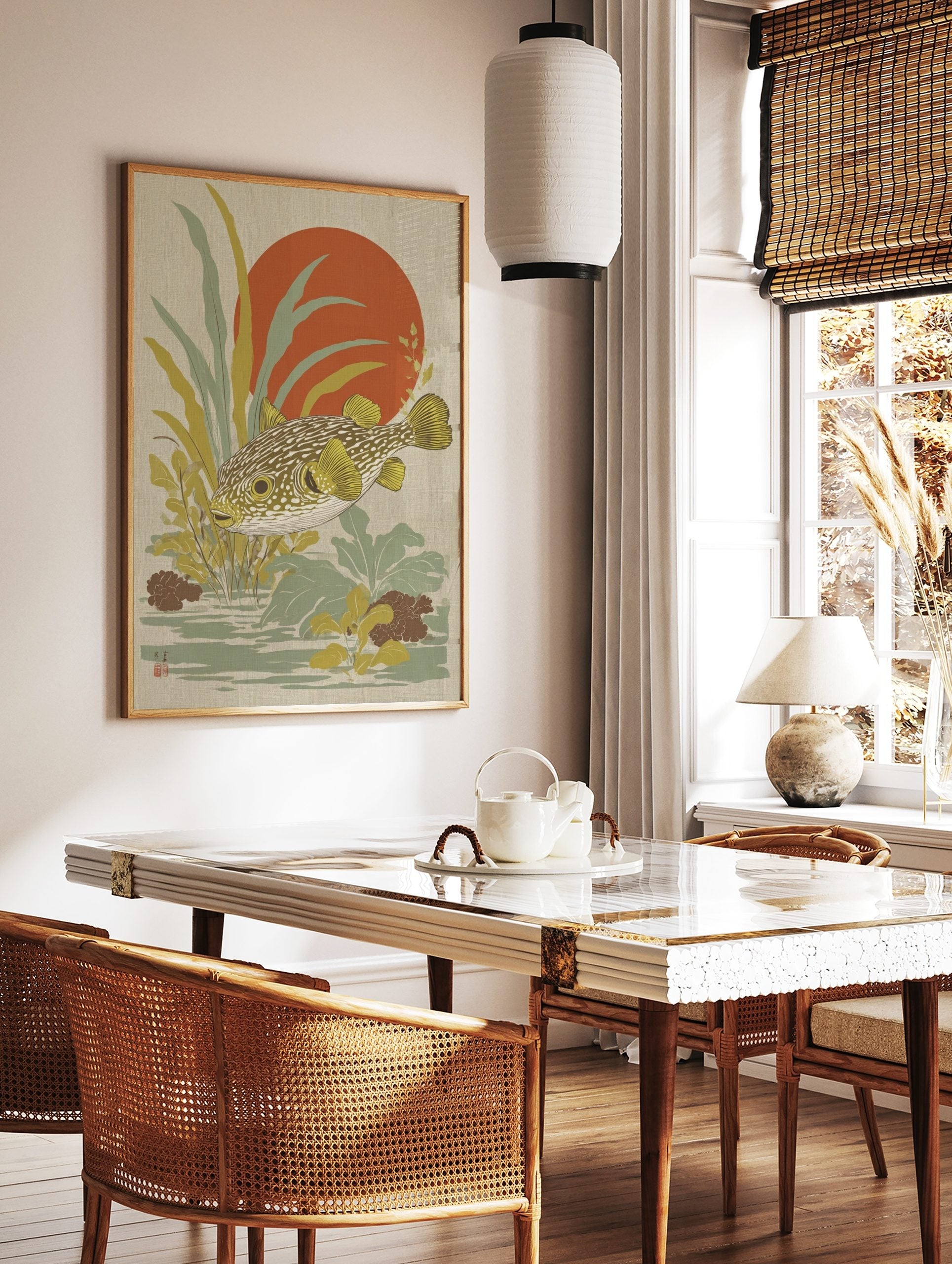 Japanese style puffer fish wall art with yellow fins, green-brown body, red sun, and aquatic plants, in a styled room mockup