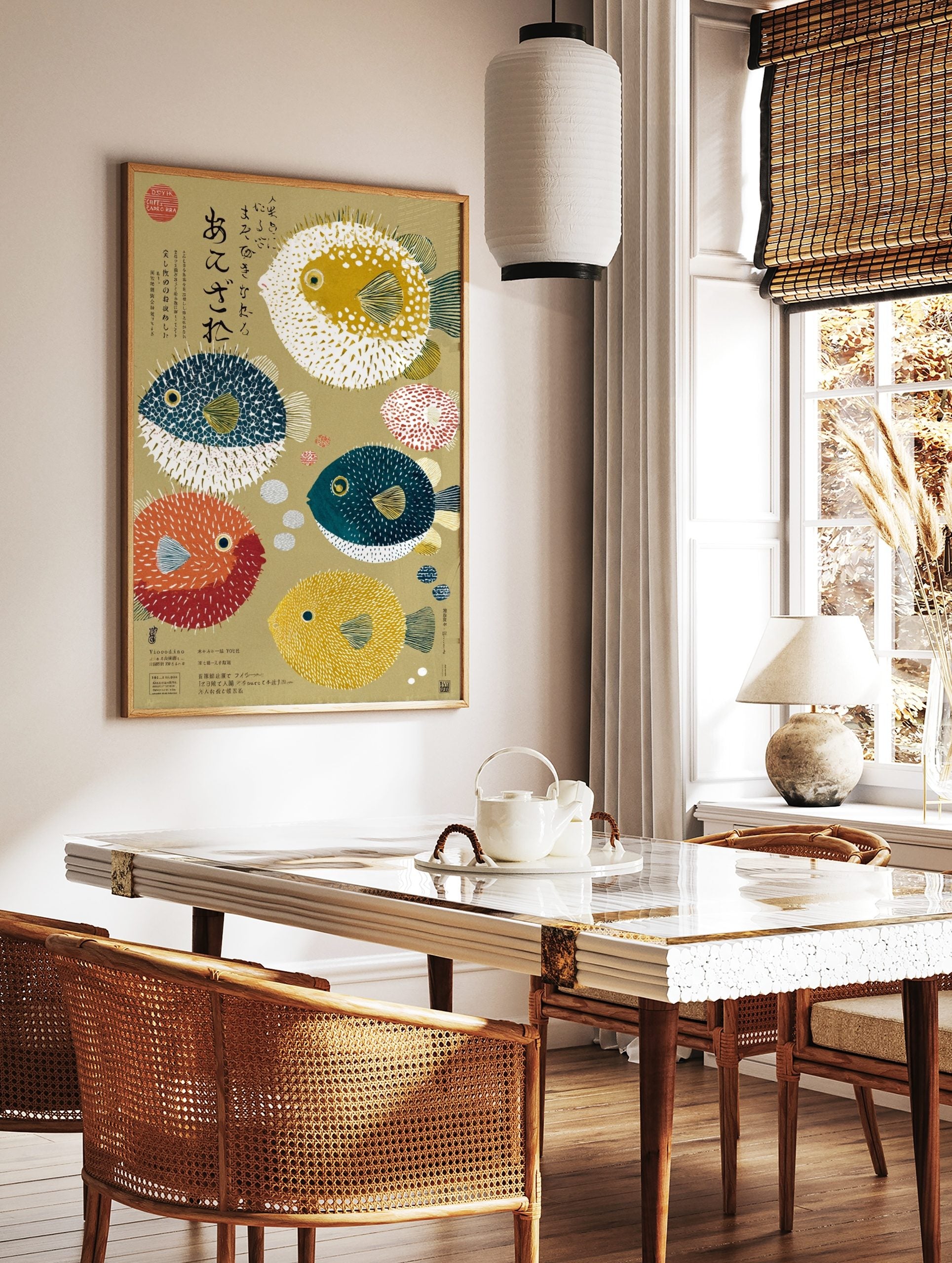 Illustrative art print of various colourful pufferfish and Japanese calligraphy on a beige, in a styled room mockup