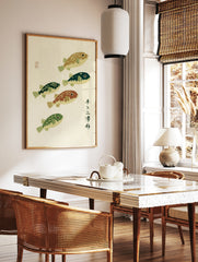 Japanese-style woodblock print with five pufferfish in varied green and brown tones, featuring, in a styled room mockup