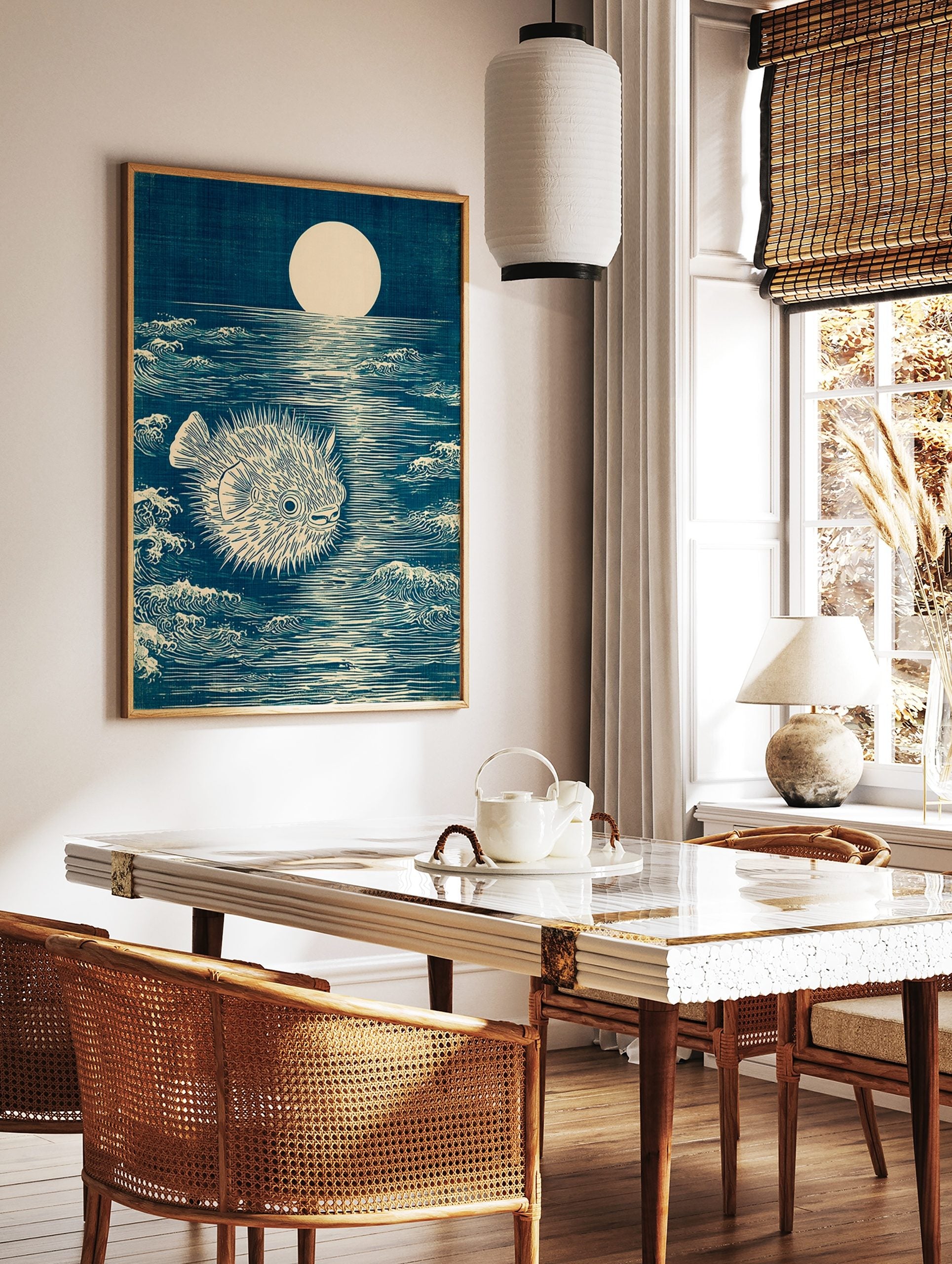 Japanese woodblock style art print of a spiky pufferfish in a dark blue moonlit ocean with waves, in a styled room mockup