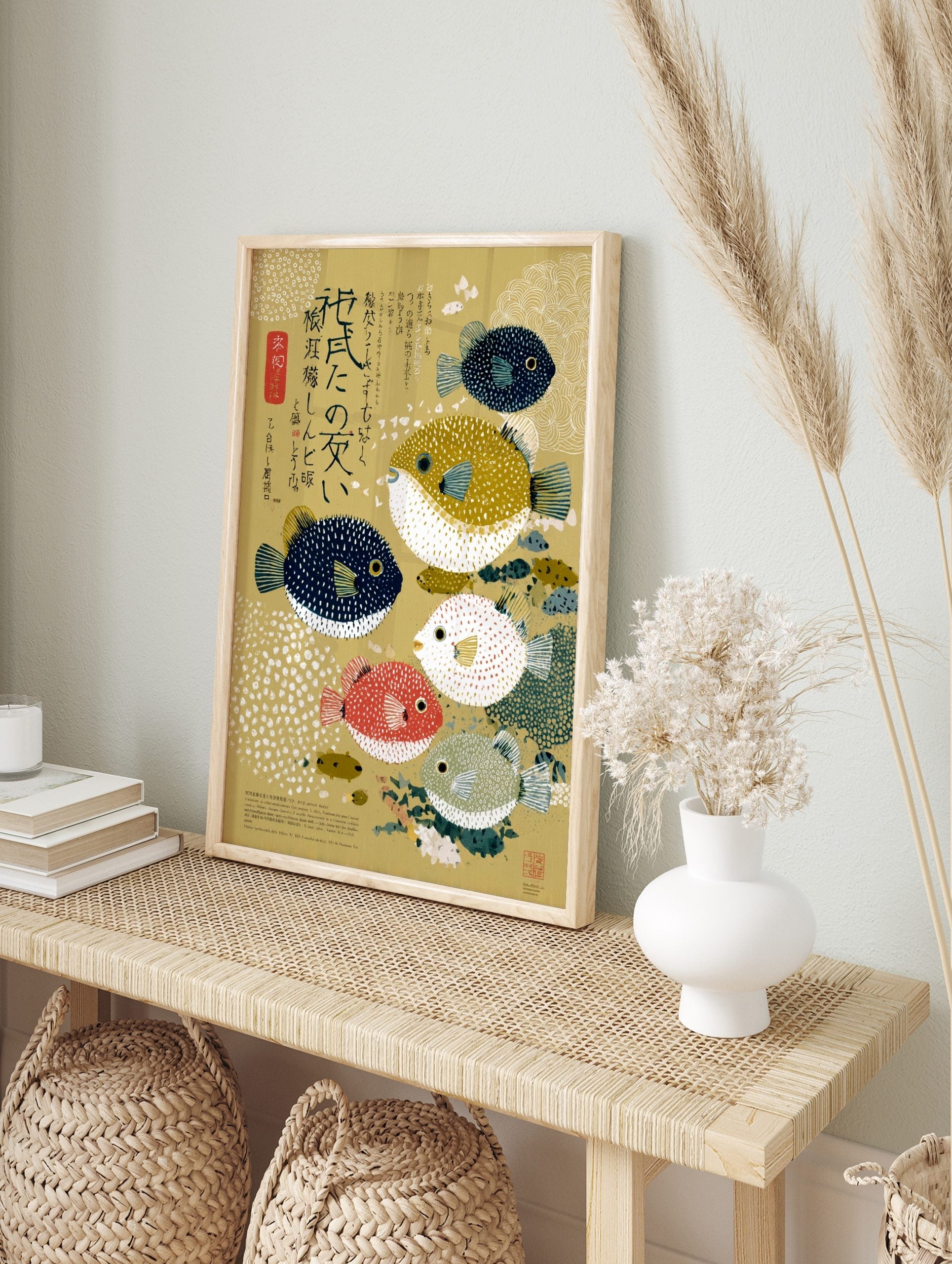 Illustrative pufferfish wall art with five colourful blowfish and Japanese text on a golden, in an alternate framed mockup