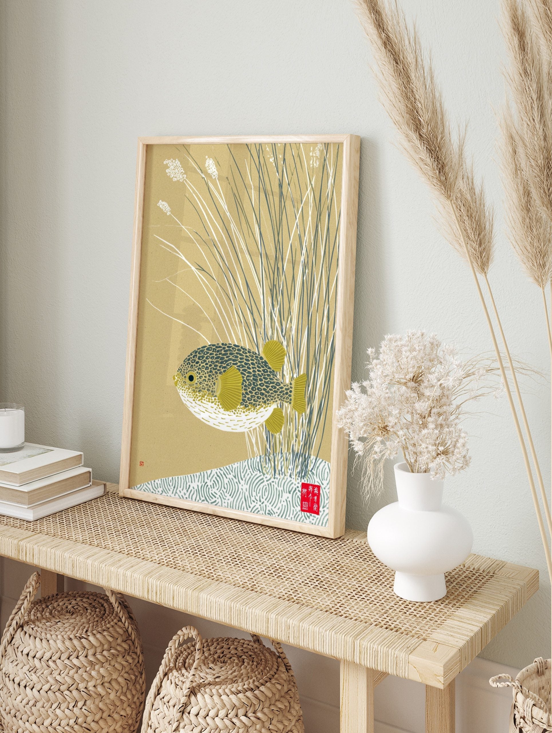 Japanese-inspired pufferfish wall art print with patterned fish and yellow fins amidst reeds, in an alternate framed mockup