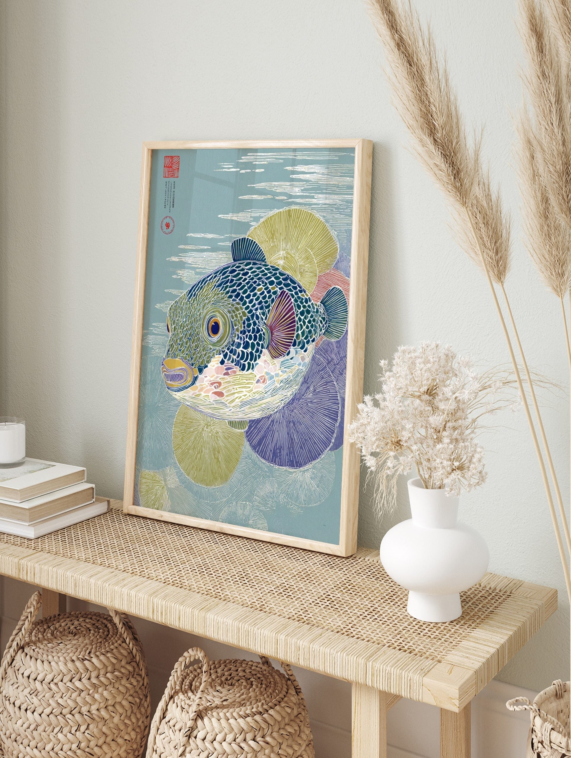 Pufferfish art print in Japanese woodblock style with blue-green scales and water ripples, in an alternate framed mockup